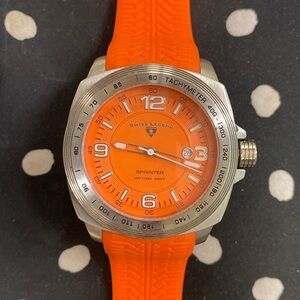Swiss legend- orange silicone band - silver face with orange background face.